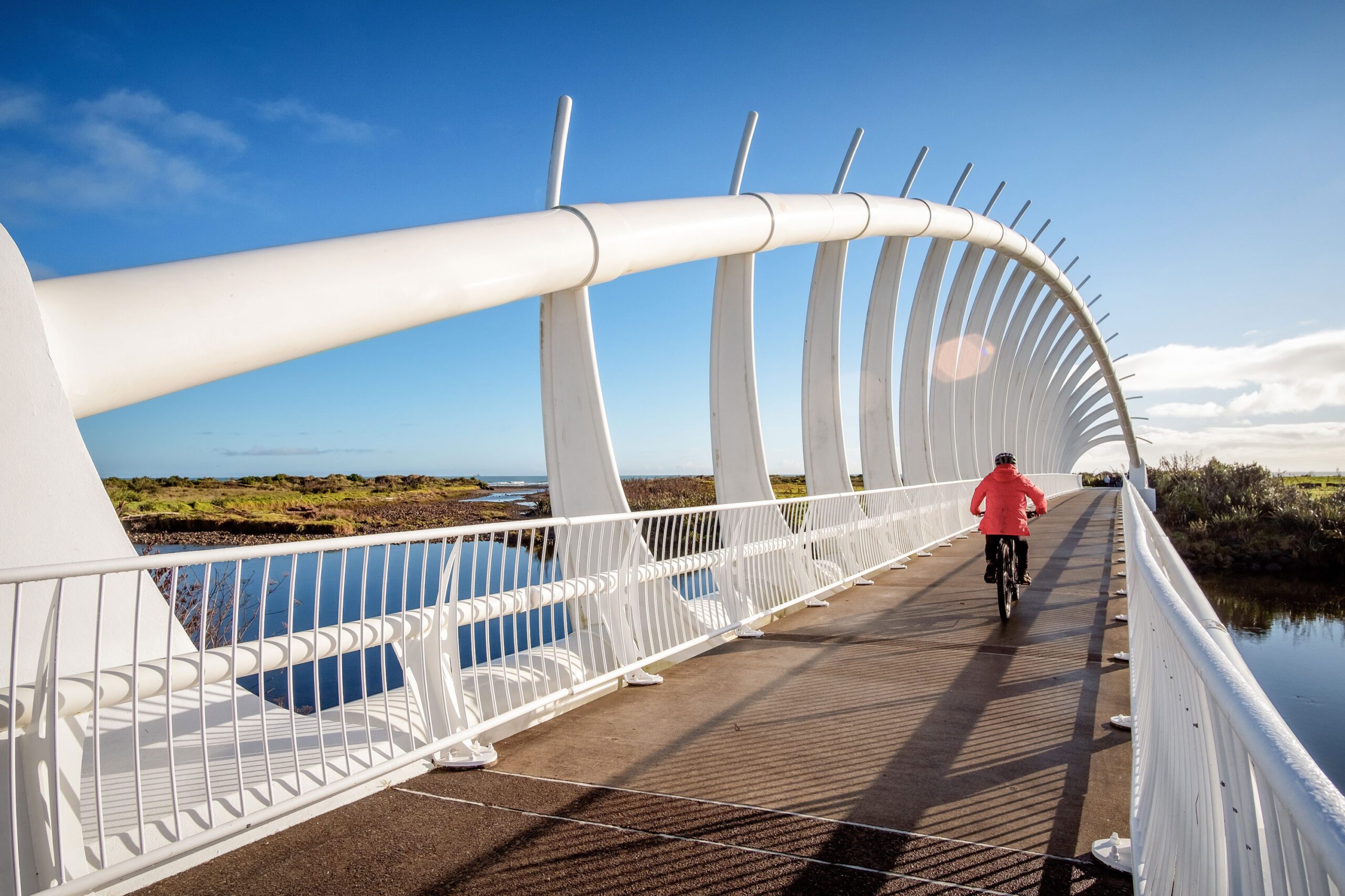 Cyclist crossing the Te Rewa Rewa Bridge in New Plymouth, Taranaki, New Zealand