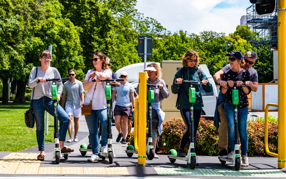 Group of e-scooters at a pedestrian crossing